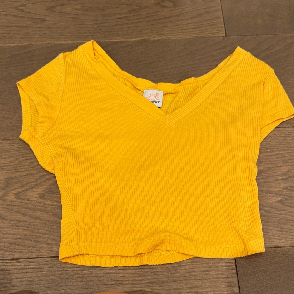 Orange V-neck crop top.